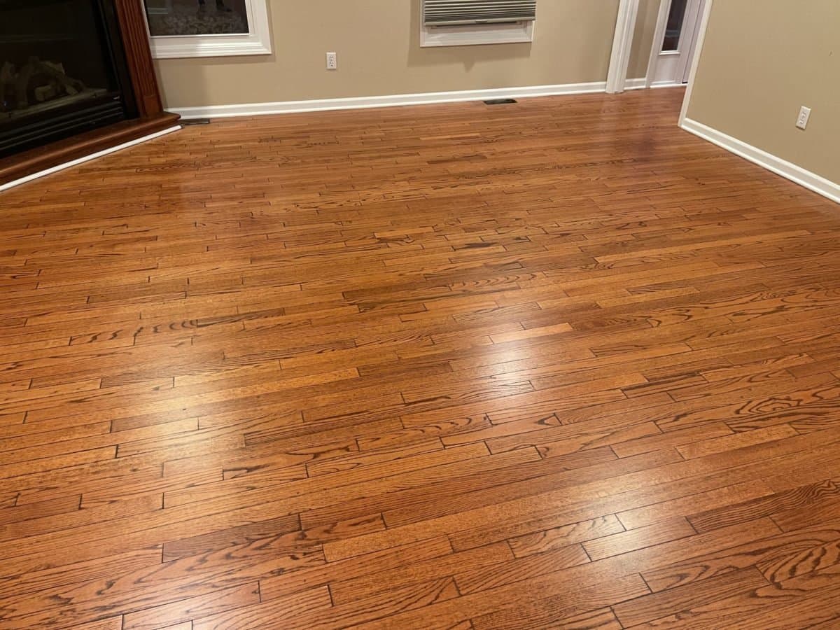 How often should hardwood floors be professionally cleaned?