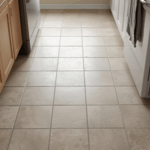 Tile floor with grout lines showing everyday dirt buildup despite regular cleaning